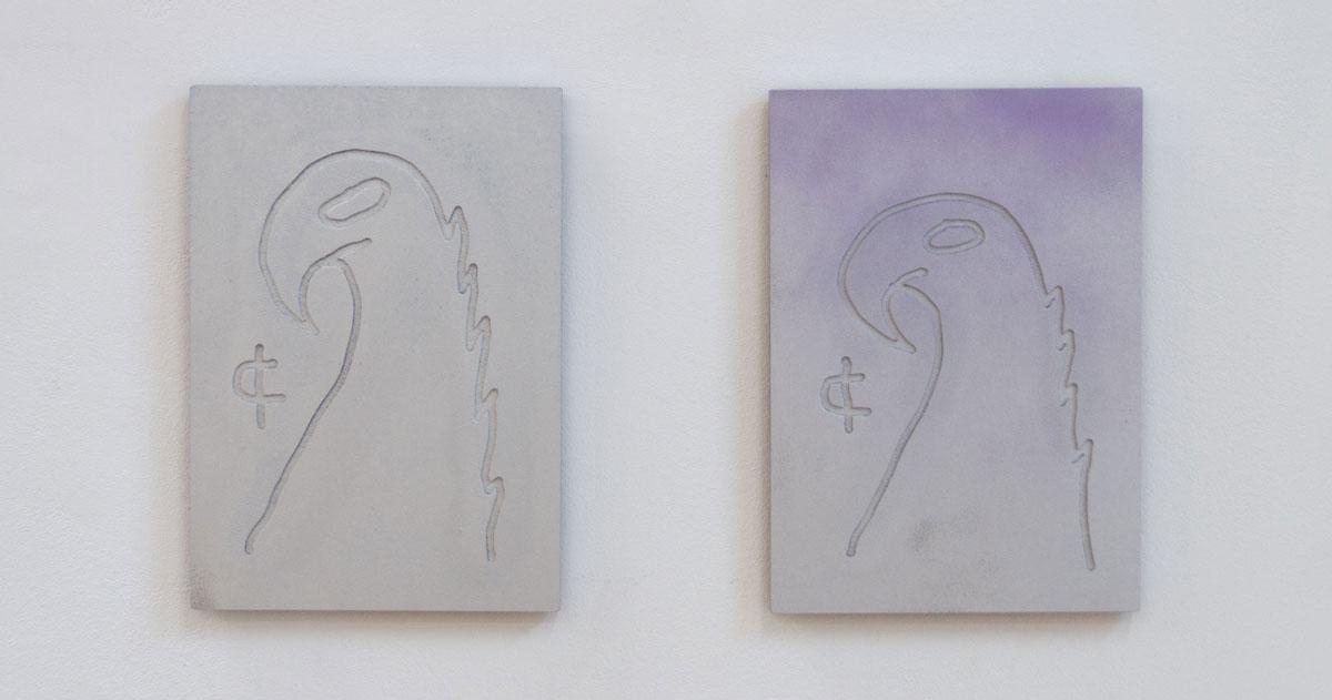 Two rectangular wall panels featuring embossed parrot silhouettes; side by side on a white gallery wall.