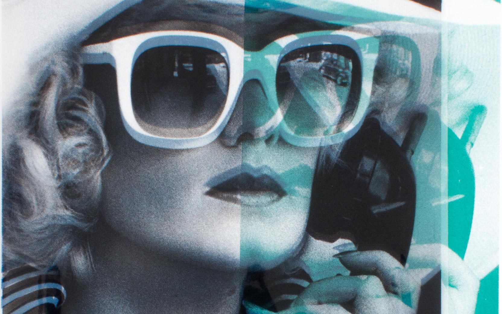 Close-up of a person with curly hair wearing oversized white sunglasses; hand near chin amid teal overlays.